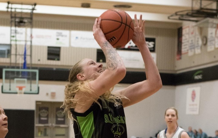 Emily White (11) earned praise from Ken King Thursday in Olds. The Management Certificate student finished with 18 points and an outstanding 24 rebounds.  Photo - Tony Hansen