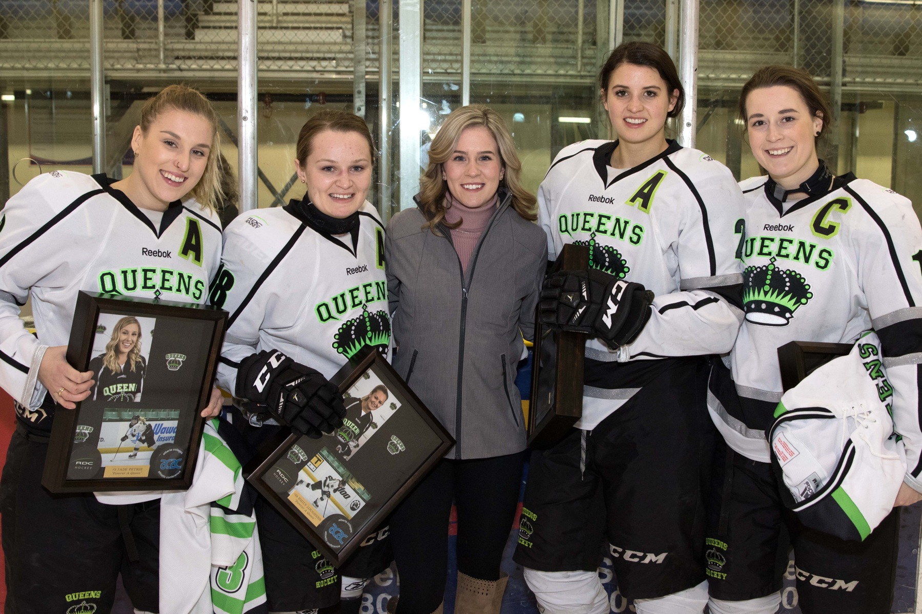 Graduating Queens from left-to-right: Jade Petrie (3), Emily Lougheed (18), Suze Vanderlinde (Assistant Coach and former Queens forward), Cassidy Anderson (2) and Julia Murrell (16)  Photo - Tony Hansen