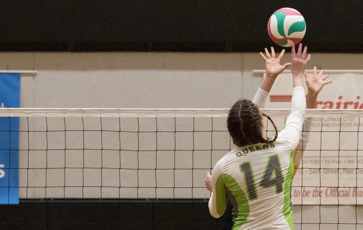 Megan Schmidt (14) helped lead the Queens to a 3 set win Saturday in Medicine Hat. The Bachelor of Business Administration student was named the Queens player-of-the-game.     Photo - Tony Hansen